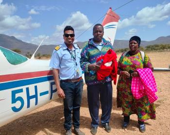 Pilot Roshan with the patient and his wife