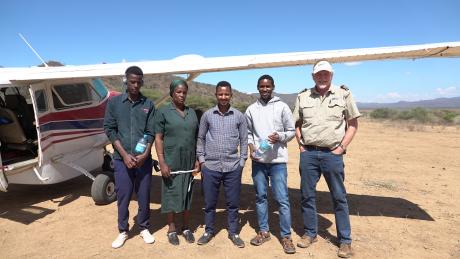 From left: Tumaini, Monica, Yohani, Pasqalu and MAF pilot Mark Liprini at Endanyawish airstrip after the mobile clinic