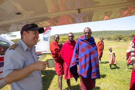 MAF pilot with locals in Olemilei