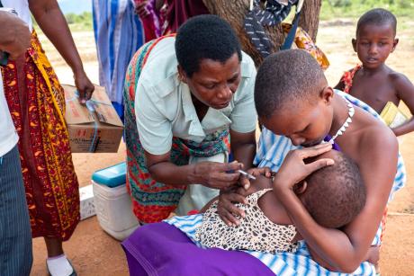 A nurse administers a vaccine to a child during a mobile clinic in Katahe where Martha was present.