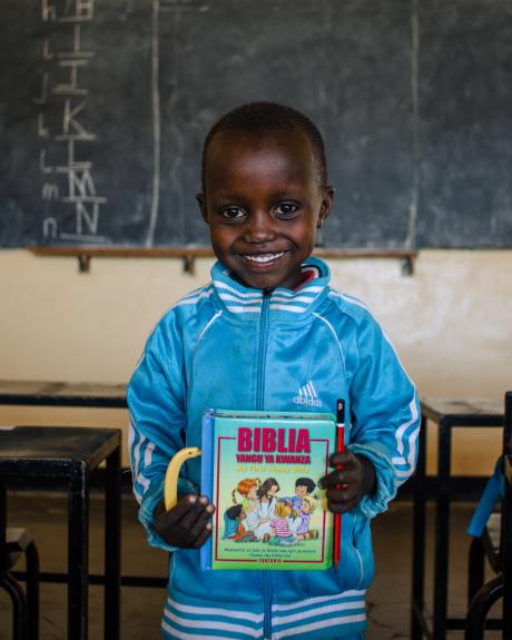 Samweli Julius holding his first bible