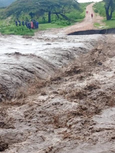 Same bridge over riverbed turned impassable upon flooding