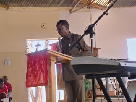 Evangelist Elisha delivering his speech at the celebration